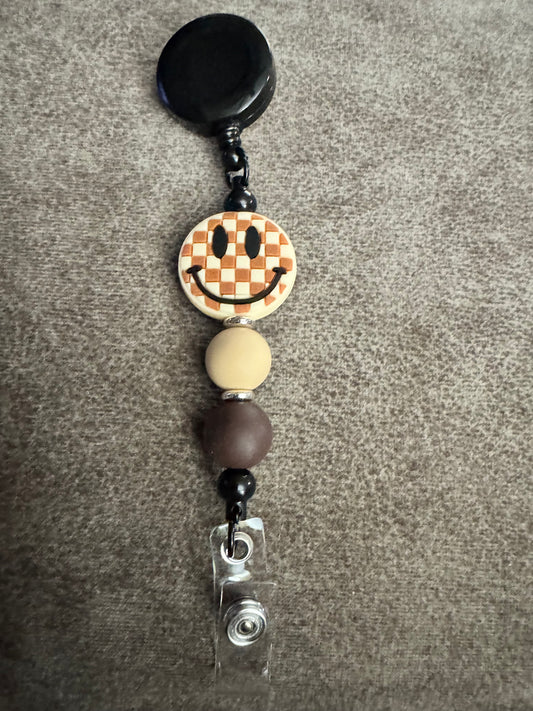 Brown Checked Smiley Face Badge Reel